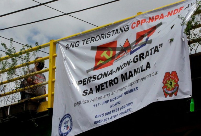 Año encourages local execs to allow anti-communist tarps