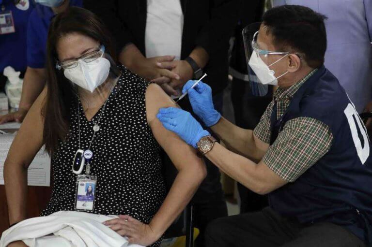 Duque administers first COVID-19 jab at Lung Center of the Philippines