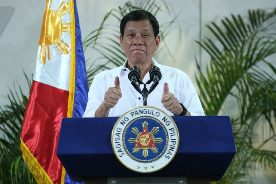 President Rodrigo Duterte gives a thumbs up during a press conference in Davao City