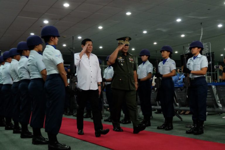 President Rodrigo Duterte is escorted by Armed Forces of the Philippines Chief of Staff Lt. General Ricardo Visaya upon arrival at F. Bangoy International Airport in Davao City on September 10