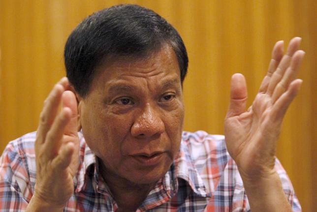Rodrigo Duterte, seven-term mayor of Davao city, who has built a reputation for fighting crime in the insurgency-plagued southern Philippines, gestures during an interview with Reuters in Manila, Philippines, in this file picture taken December 10, 2015. REUTERS/Czar Dancel/Files
