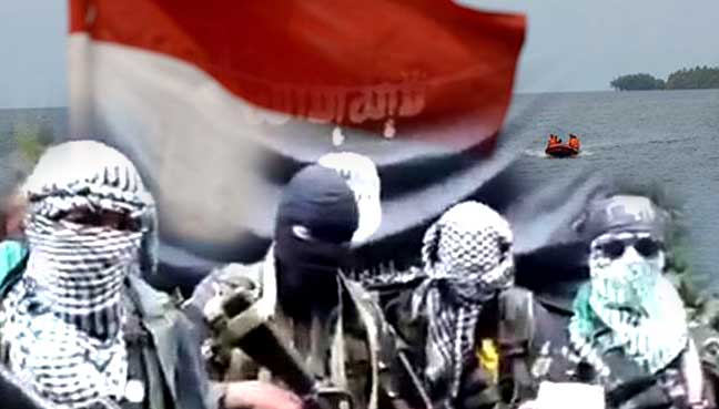 Veiled Abu Sayyaf gunmen pictured in front of jihadi flag