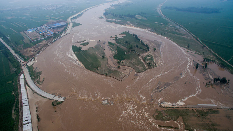 Heavy Rains Kill 87, An aerial view shows that roads and fields are flooded in Xingtai, Hebei Province, China, July 21, 2016. REUTERS/Stringer