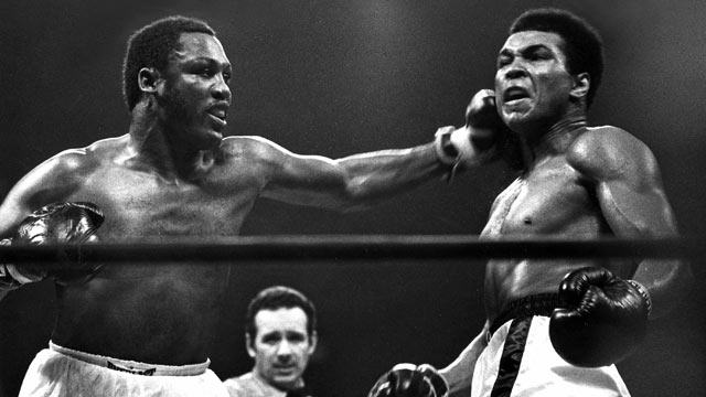 muhammad-ali-getting-hit-by-a-left-hook-from-joe-frazier-during-the-fight-of-the-century-in-madison-square-garden-in-1971
