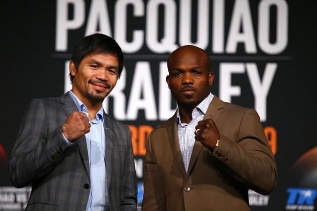 Jan 21, 2016; New York, NY, USA; Manny Pacquiao and Timothy Bradley, Jr. pose for a photo during press conference at Madison Square Garden to announce the upcoming boxing fight on April 9, 2016 in Las Vegas. Mandatory Credit: Noah K. Murray-USA TODAY Sports