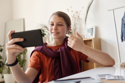 photo of girl using black smartphone 4144288