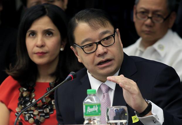 Lorenzo Tan, president and chief executive officer of the Rizal Commercial Banking Corp (RCBC), gestures while answering questions during the money laundering hearing at Senate in Manila March 29, 2016. REUTERS/Romeo Ranoco